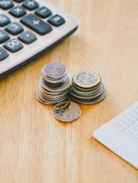 stack-of-money-coin-on-woo-office-desk-with-bank-b-2023-02-22-00-26-03-utc